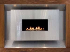 modern stainless steel and walnut gas fireplace